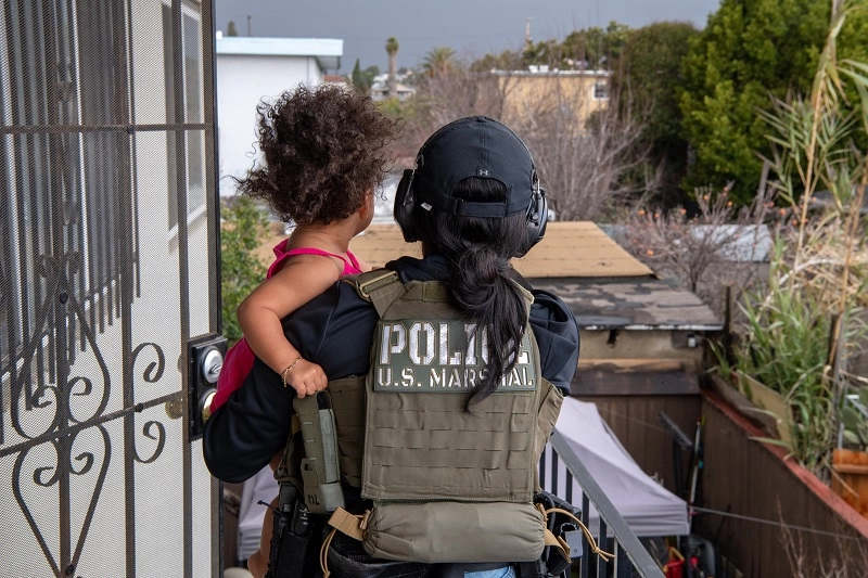 Female Deputy U.S. Marshals with a toddler